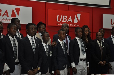 Pix of UBA Foundation's 2013 National Essay Competition 4: Divisional Head, Marketing and Corporate Relations, UBA Plc, Mr. Charles Aigbe; Managing Director, UBA Foundation, Ms. Ijeoma Aso; Vice Principal, Kings College, Mr. Charles Utomi ; and a judge and Professor Ralph Akinfeleye, with students of Kings College, Lagos,  during the press launch announcing Call for Entries for 2013 UBA Foundation National Essay Competition for Secondary Schools in Nigeria, held in Lagos recently